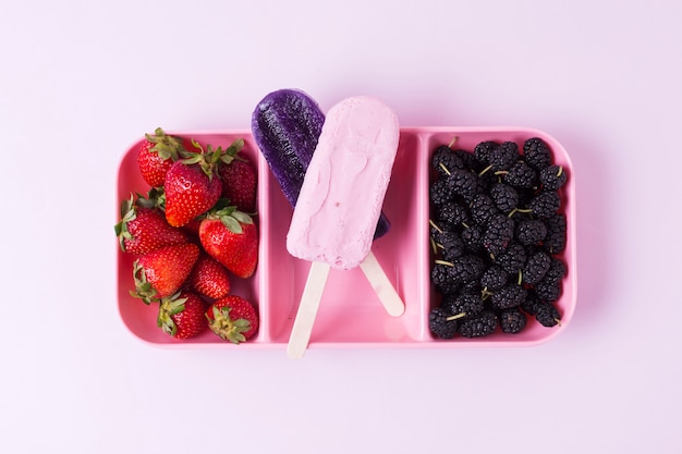 top view ice cream with strawberries and blackberries