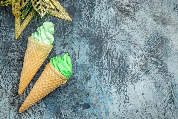 Top view ice creams xmas ornaments on grey background