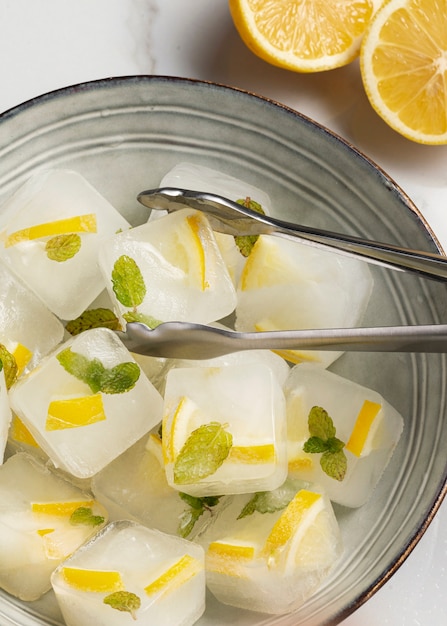 Top view  ice cubes with lemon