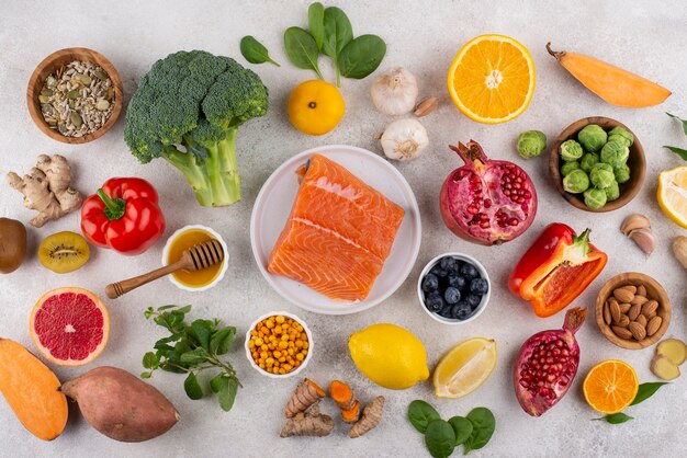 Top view of immunity boosting foods with vegetables and fish