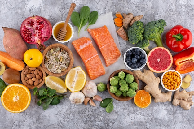 Top view of immunity boosting foods with vegetables and fish