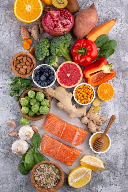 Top view of immunity boosting foods with vegetables and fish