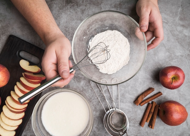 Top view individual preparing a dessert