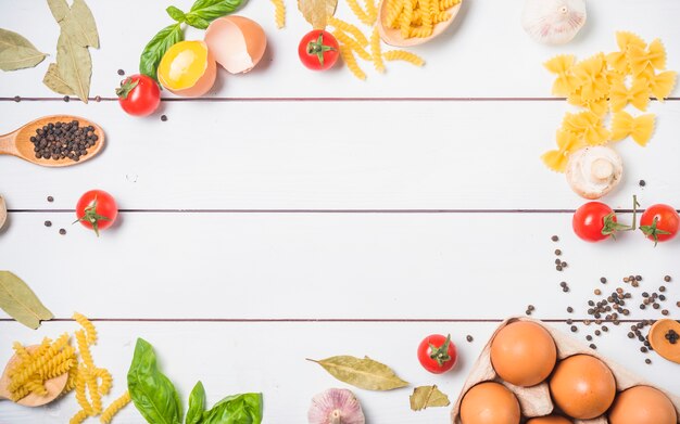 Top view of ingredients for making pasta with free space for text