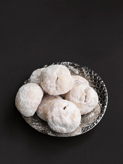 Top view islamic pastries on black background