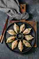 Free photo top view japanese dumplings assortment