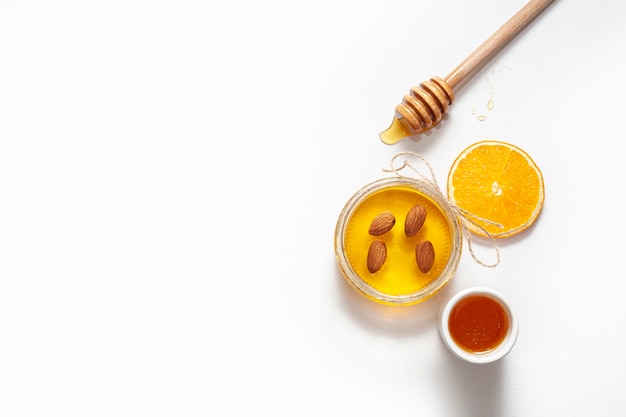 Top view jar with honey and stick