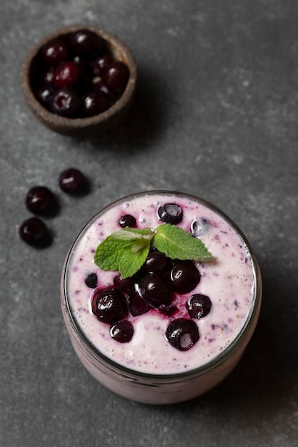 Top view jar with smoothie and cherries