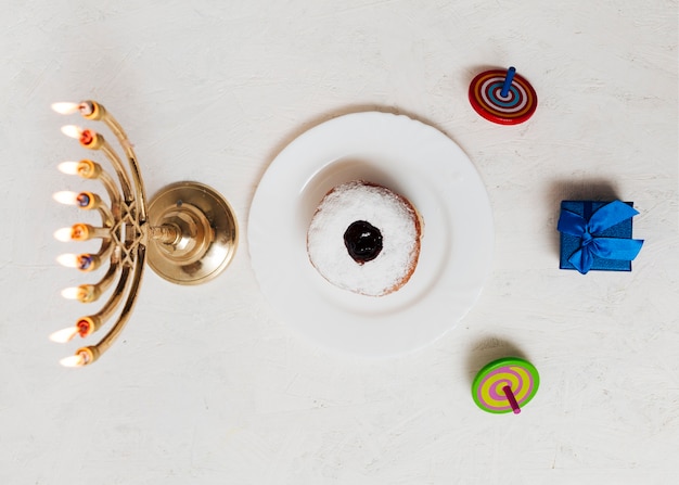 Free photo top view jewish menorah and sweets