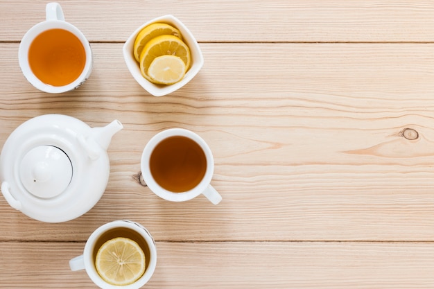 Free photo top view of kettle and tea cups