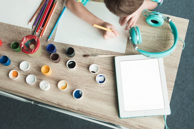 Top view of kids painting