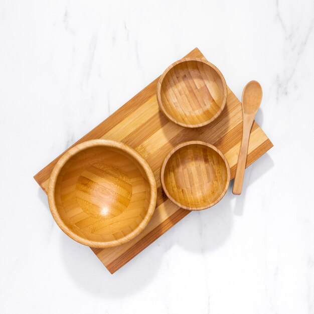 Top view kitchenware on wooden board