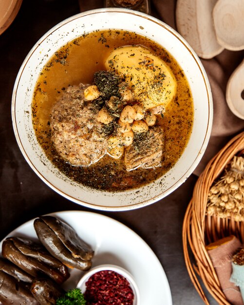 Top view kyufta bozbash traditional azerbaijani dish with peas in kyasa plate