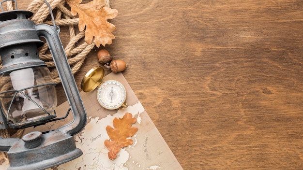 Top view of lantern with autumn leaves and copy space