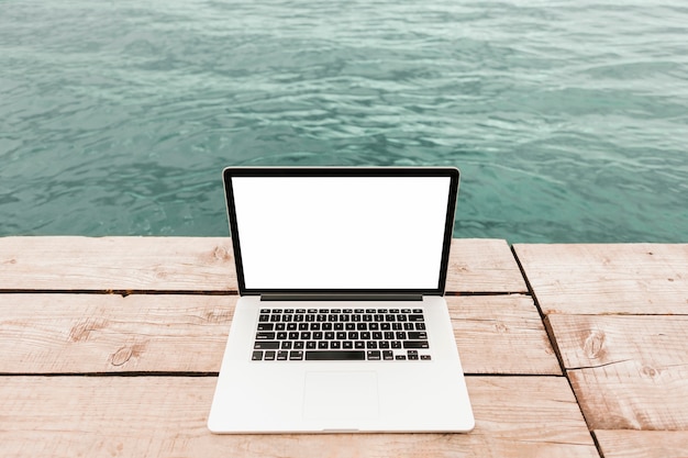 Top view laptop by the water