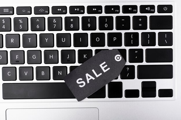 Top view laptop keyboard with sale tag