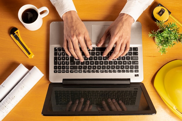 Top view laptop with coffee and stationery items