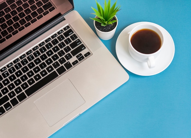 Free photo top view of laptop with coffee