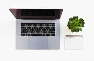 Free photo top view laptop with white background