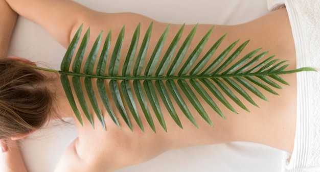 Top view leaf on woman back