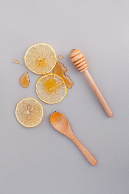 Top view lemon slices with honey