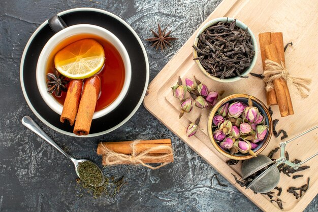 Top view lemon tea in cup and kettle on a gray background color morning fruit breakfast photo food ceremony