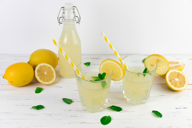 Free photo top view lemonade glasses arrangement