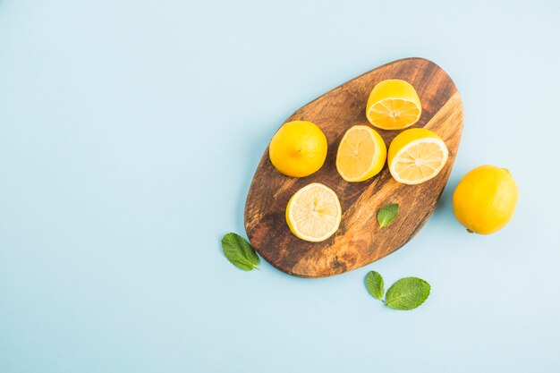 Top view lemons on a board