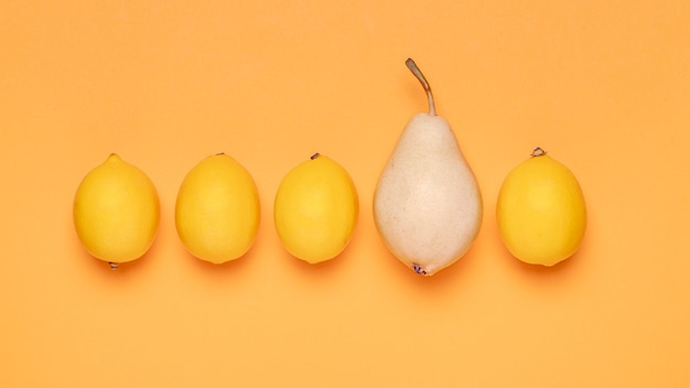 Free photo top view lemons and pear arrangement