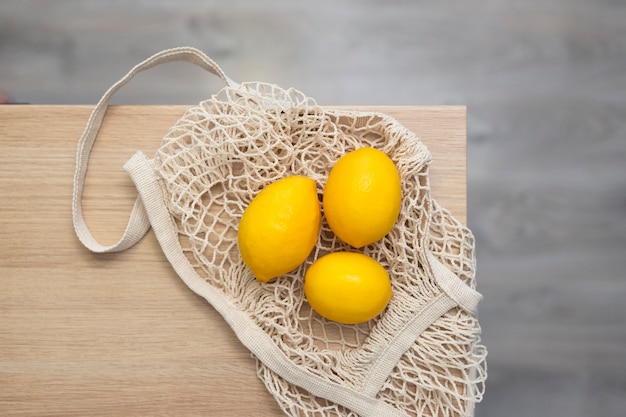 Top view lemons on zero waste bag