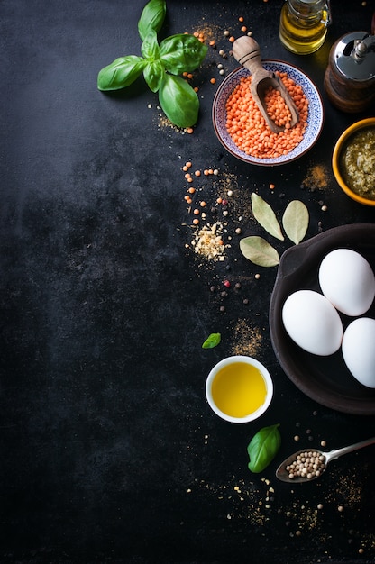 Top view of lentils with three eggs