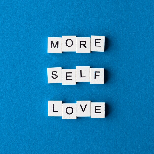 Top view letter cubes on blue background