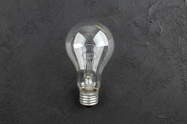 Top view light bulb on black table