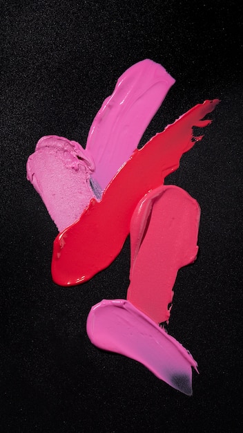 Free photo top view lipstick shades on dark background