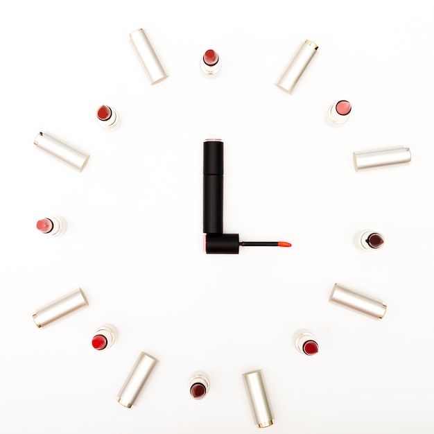 Top view lipsticks simulating clock