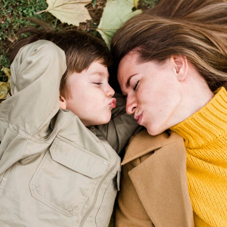 Free Photo top view little boy and mother being cute