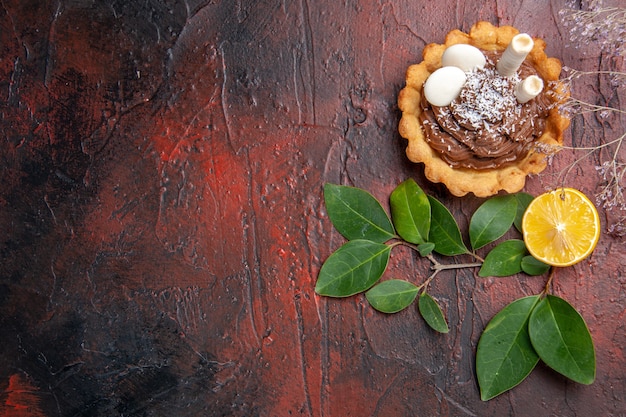 Top view little cake on dark table dessert biscuit cookie sweet