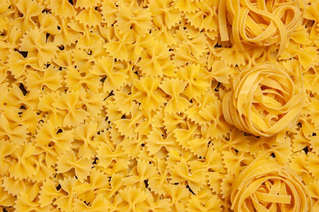 Top view little raw pasta dough food color meal photo italian pasta many