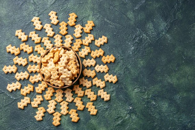 Top view of little salted crackers in bowl