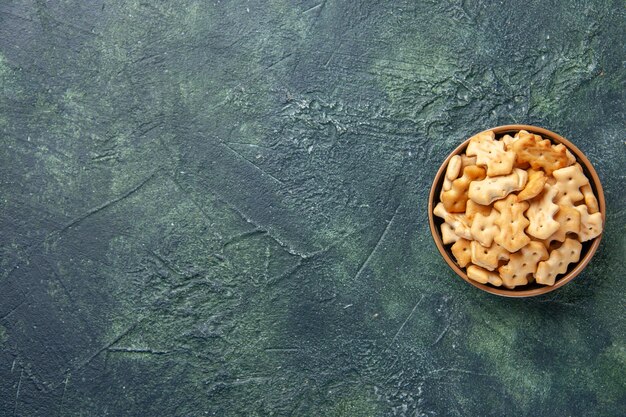 Top view of little salted crackers in bowl