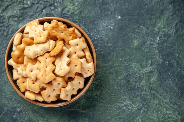 Top view of little salted crackers in bowl