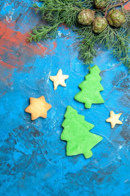 Top view of little tree figures on a blue surface