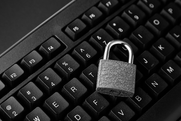 Top view of a lock on a black computer keyboard