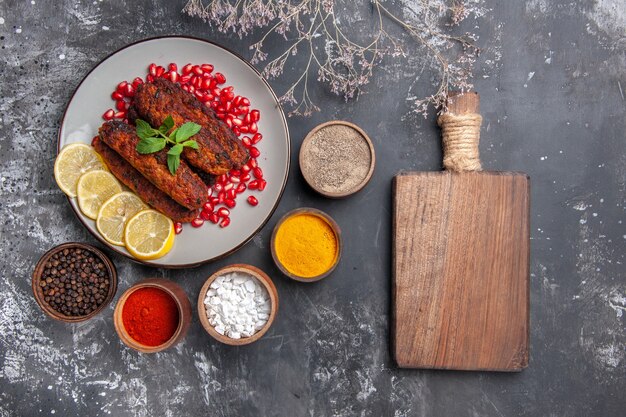 Top view long meat cutlets with seasonings