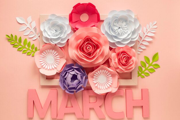 Вид сверху на множество бумажных цветов с месяцем на женский день