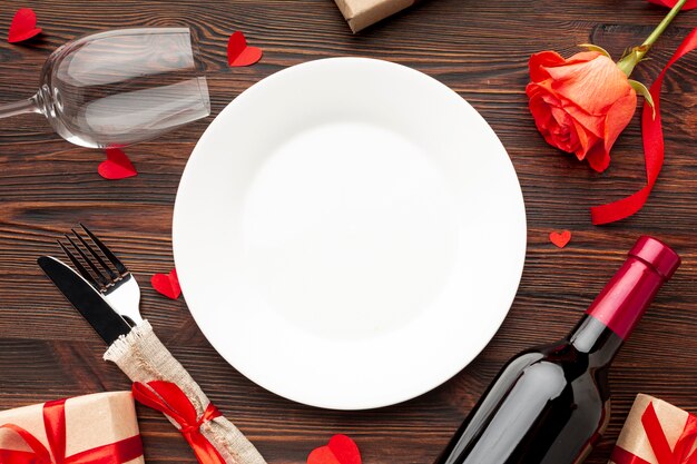Top view lovely arrangement for valentines day dinner on wooden background