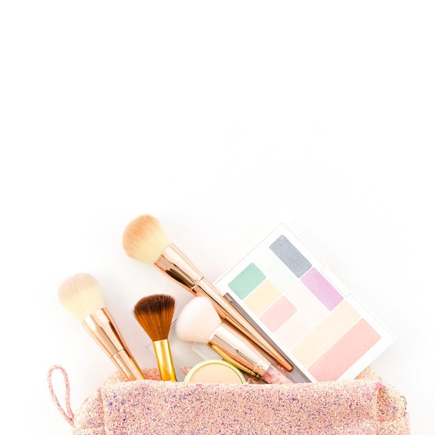 Top view make up brushes in toilet bag