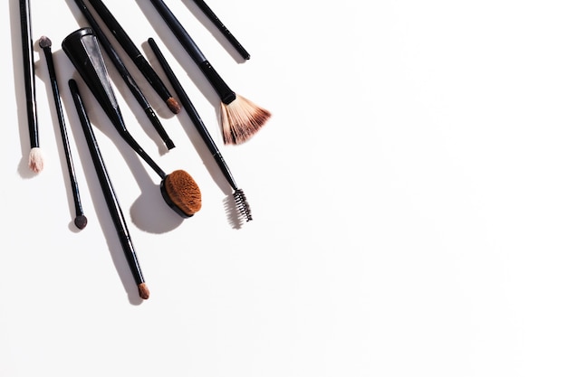 Free photo top view make up brushes on white background