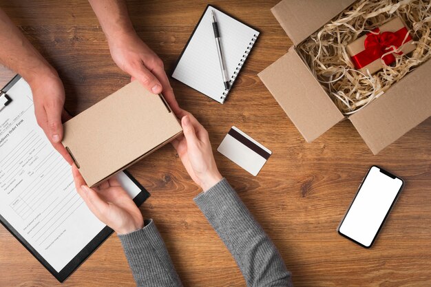 Top view man handing a cyber monday package to a woman