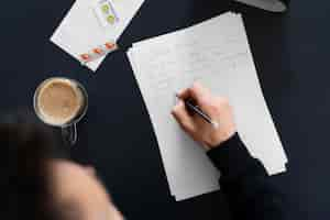 Free photo top view man writing letter